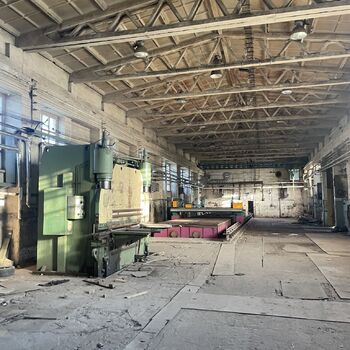 an abandoned boat repair shop with a police boat