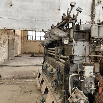 an abandoned boat repair shop with a police boat