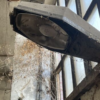 an abandoned boat repair shop with a police boat