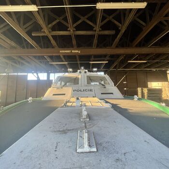 an abandoned boat repair shop with a police boat
