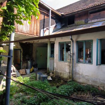 An abandoned house in the middle of a village