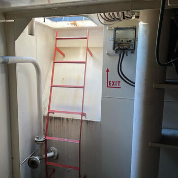 an abandoned boat repair shop with a police boat