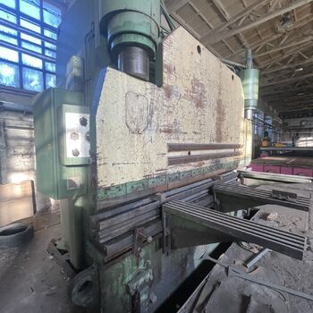an abandoned boat repair shop with a police boat
