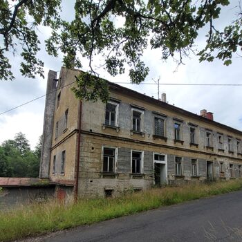 An abandoned apartment building in the village.