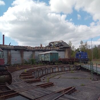 The depot with a collapsed roof and a slowly crumbling station building.2024 The depot with a collapsed roof and a slowly crumbling station building.2024