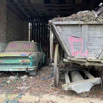 Abandoned farmhouses side by side.