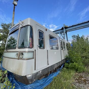 an abandoned boat repair shop with a police boat