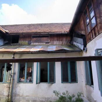 An abandoned house in the middle of a village