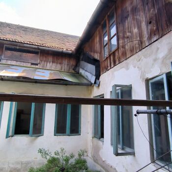 An abandoned house in the middle of a village