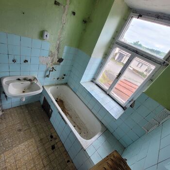 An abandoned apartment building in the village.