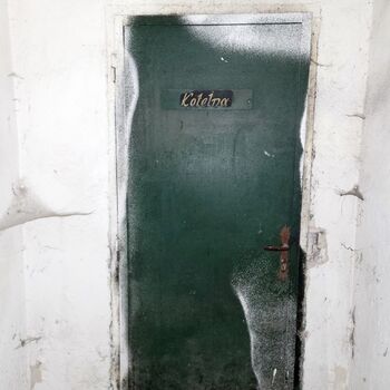 An abandoned apartment building in the village.