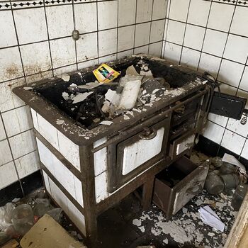Abandoned farmhouses side by side.