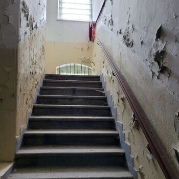 An abandoned apartment building in the village.