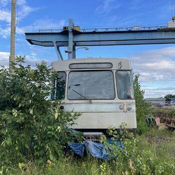 an abandoned boat repair shop with a police boat