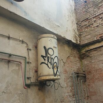 old graffito barbershop wall architecture