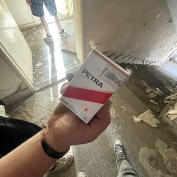 an abandoned boat repair shop with a police boat