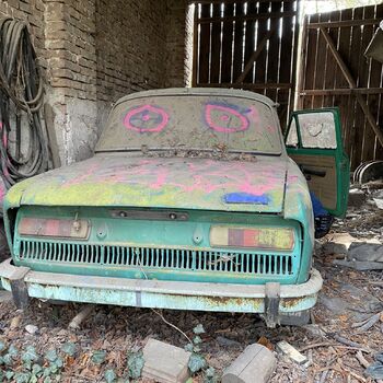 Abandoned farmhouses side by side.