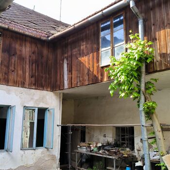 An abandoned house in the middle of a village