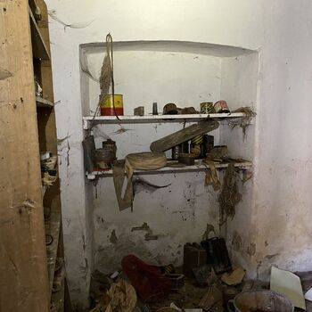 Abandoned farmhouses side by side.