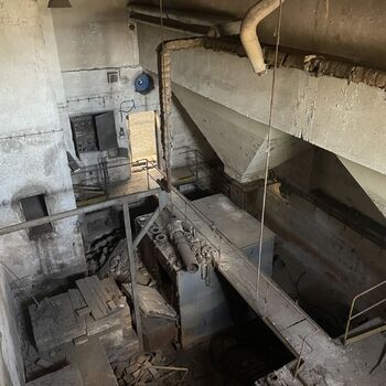 an abandoned boat repair shop with a police boat