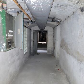 An abandoned apartment building in the village.