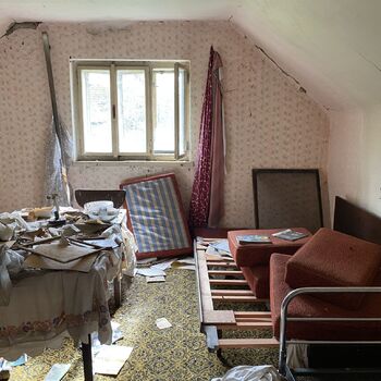 Abandoned farmhouses side by side.