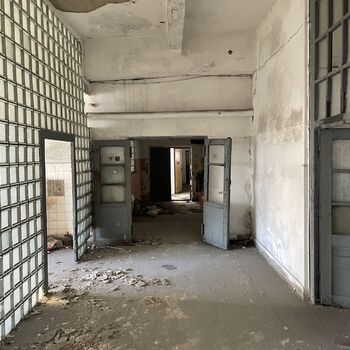 an abandoned boat repair shop with a police boat