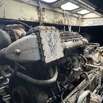 an abandoned boat repair shop with a police boat