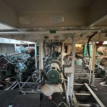 an abandoned boat repair shop with a police boat