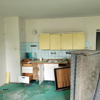 An abandoned apartment building in the village.