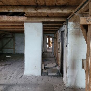 An abandoned apartment building in the village.