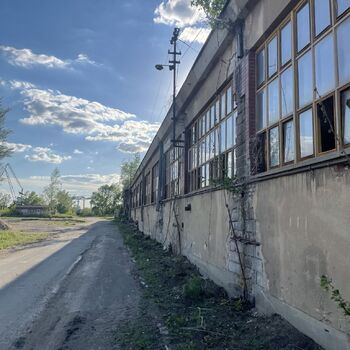 an abandoned boat repair shop with a police boat