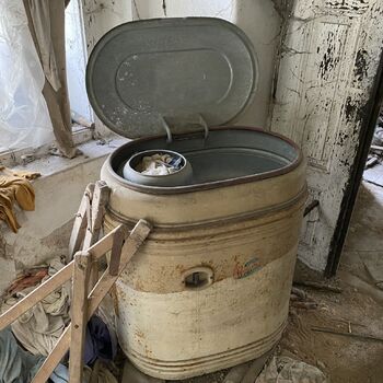 Abandoned farmhouses side by side.