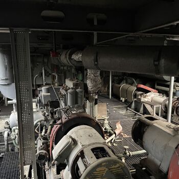 an abandoned boat repair shop with a police boat
