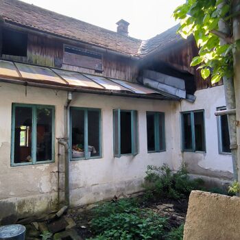 An abandoned house in the middle of a village