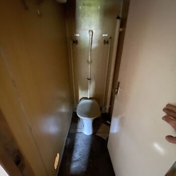 an abandoned boat repair shop with a police boat