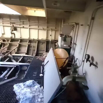 an abandoned boat repair shop with a police boat