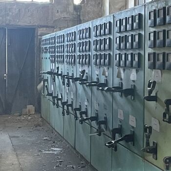 an abandoned boat repair shop with a police boat