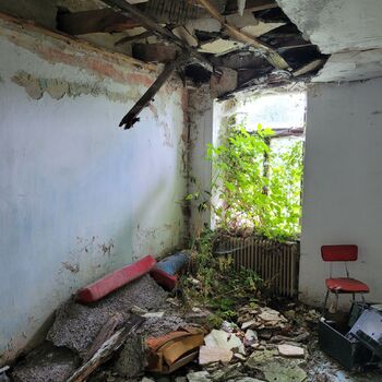 An abandoned apartment building in the village.