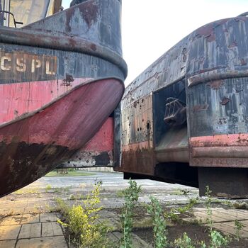 an abandoned boat repair shop with a police boat