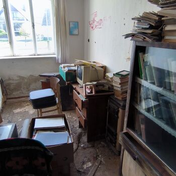 An abandoned house in the middle of a village