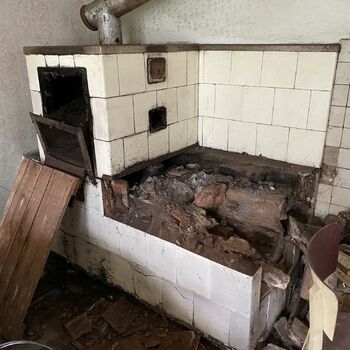 Abandoned farmhouses side by side.