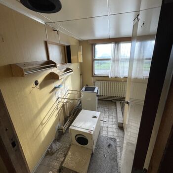 an abandoned boat repair shop with a police boat