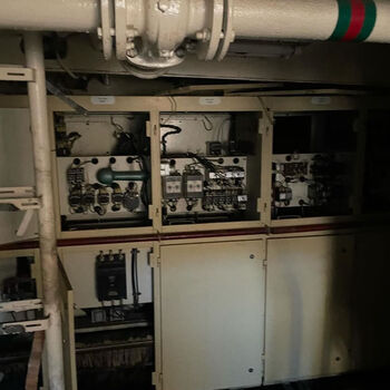 an abandoned boat repair shop with a police boat