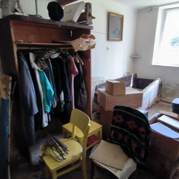 An abandoned house in the middle of a village