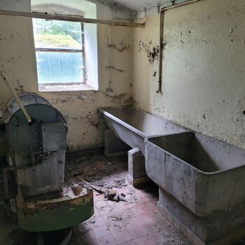 An abandoned apartment building in the village.