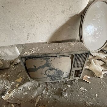 an abandoned boat repair shop with a police boat