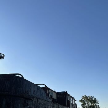 an abandoned boat repair shop with a police boat
