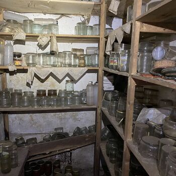 Abandoned farmhouses side by side.