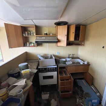 an abandoned boat repair shop with a police boat